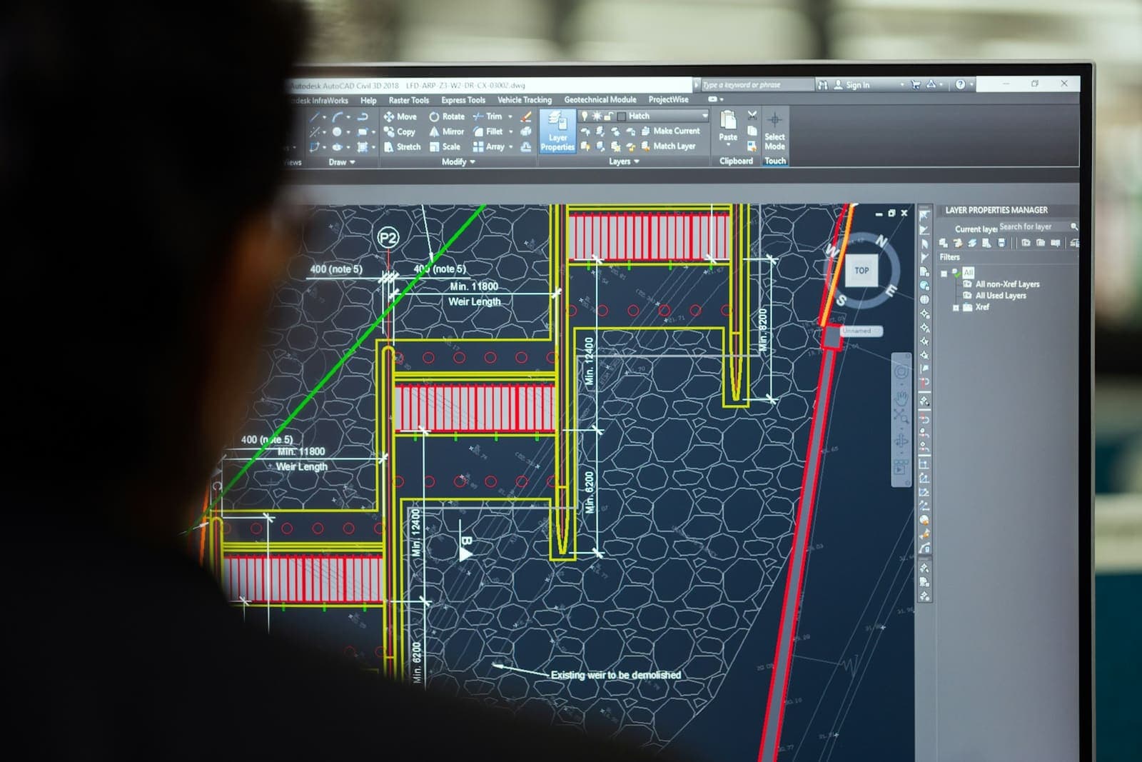 A CAD drawing open in AutoCAD on a large monitor